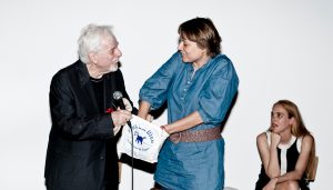 Jodorowsky hands Majewski the gold ingots. Photography: Oliver Helbig